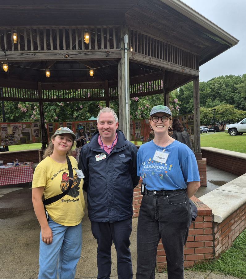 Extension Director posing with Carrboro Market Staff in Carrboro. 