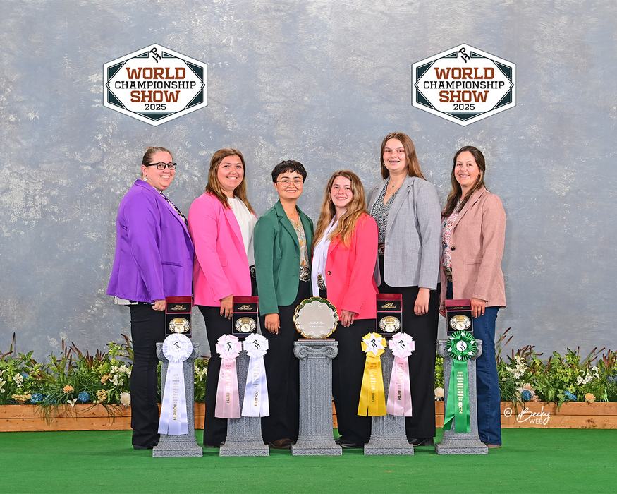 Six women standing with ribbons and trophies, "WORLD CHAMPIONSHIP SHOW 2025" logos above