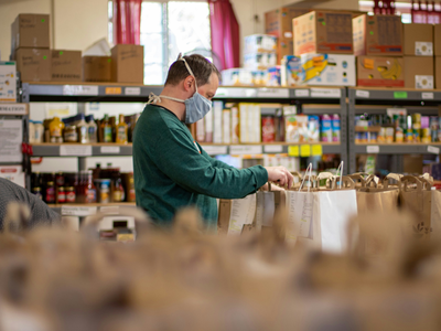 Volunteer labeling food pantry bag