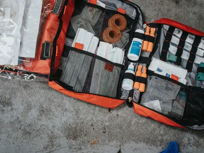 An orange bag filled with emergency supplies.