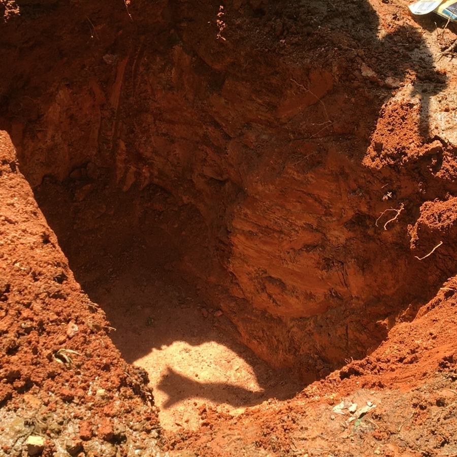 A deep hole dug for a dry well.