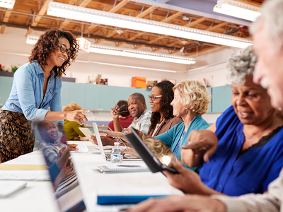 Senior Planet licensing photo lady teaching a tech class