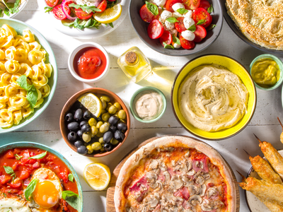 Mediterranean foods including Hummus, Olives, Tortellini, Caprese Salad and more.
