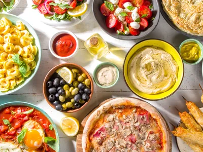 Mediterranean foods including Hummus, Olives, Tortellini, Caprese Salad and more.