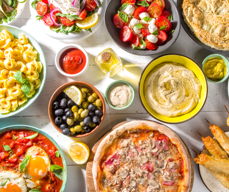Mediterranean foods including Hummus, Olives, Tortellini, Caprese Salad and more.