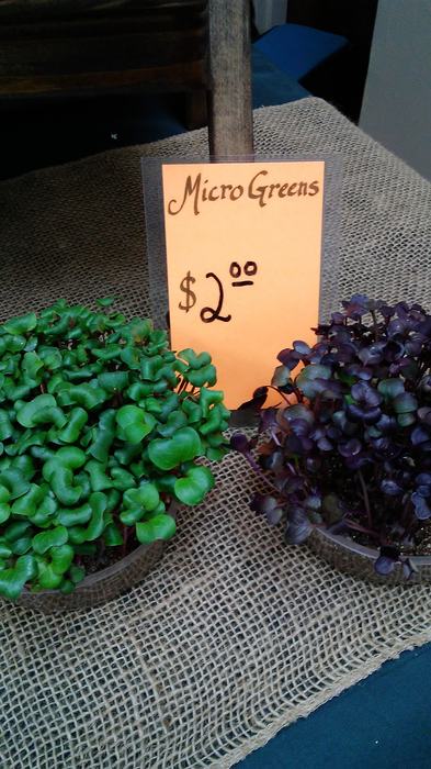A sign selling MicroGreens for $2.