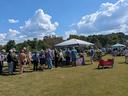 Customers lining up at the Growing Wild Nursery booth.