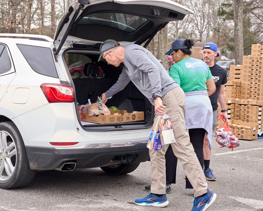 Volunteers packing car with groceries at a PORCH Hillsborough event. 