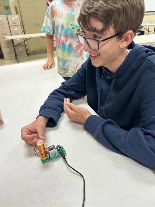 Pamlico County 4-H member assembling a mini Tesla coil as part of It’s Electric project.