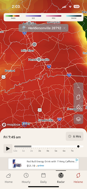 Weather radar map showing extreme storms (red and orange) over the Hendersonville, North Carolina area.