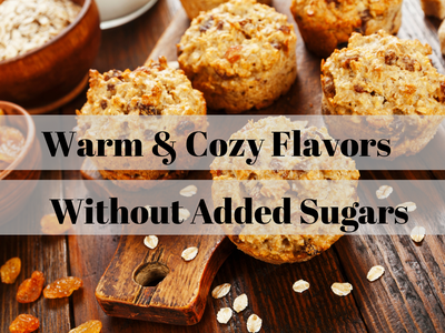 Oat muffins on a wooden board with text: "Warm & Cozy Flavors; Without Added Sugars"