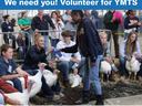Turkey show volunteer handing out a ribbon on show day. Turkeys and competitors in a showring holding ribbons.