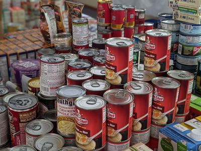 canned foods stacked on tables