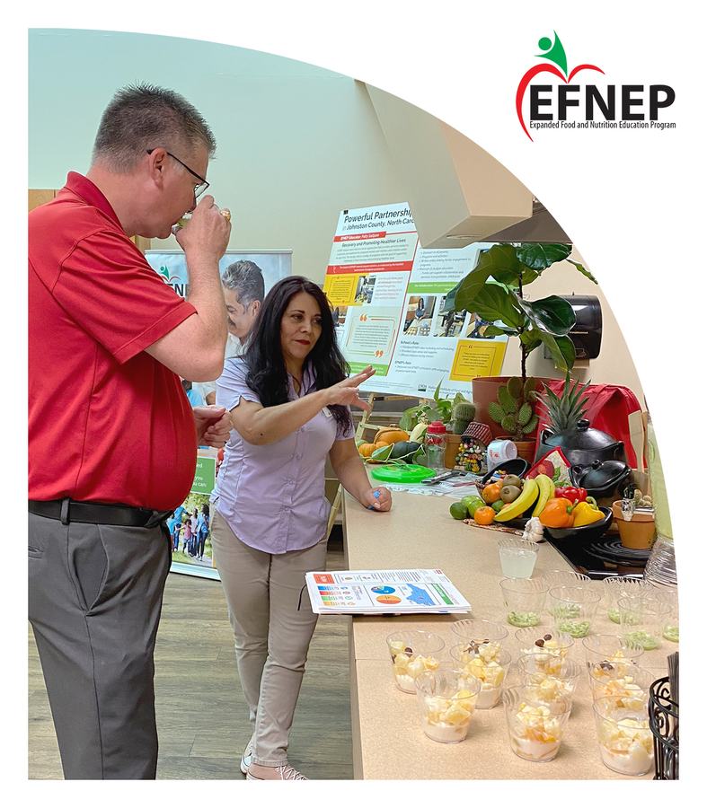 Johnston County EFNEP Educator (Patty S.) speaking to Dean Fox about EFNEP.