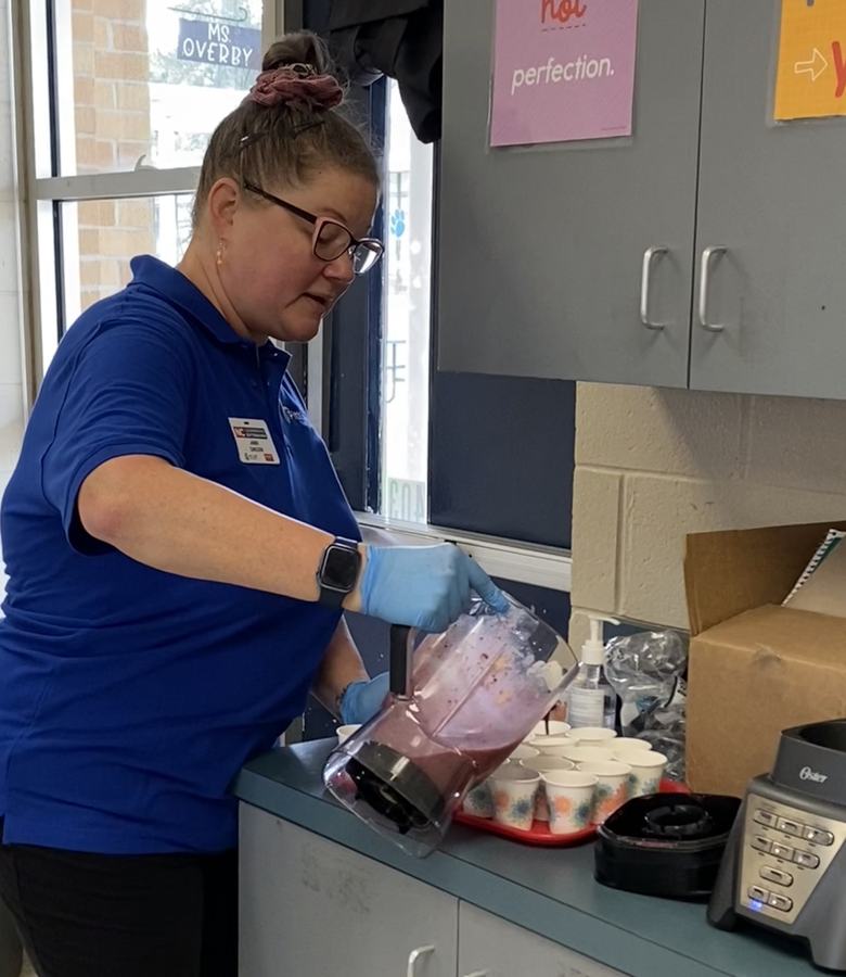 Jamie serving smoothies