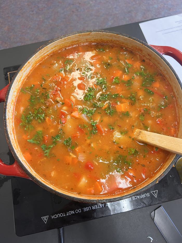 Fresh hot soup in a bowl.