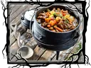 Vegetable stew in cast iron pot.