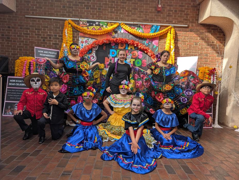 magetsi dancers pose after day of the dead celebration in costume