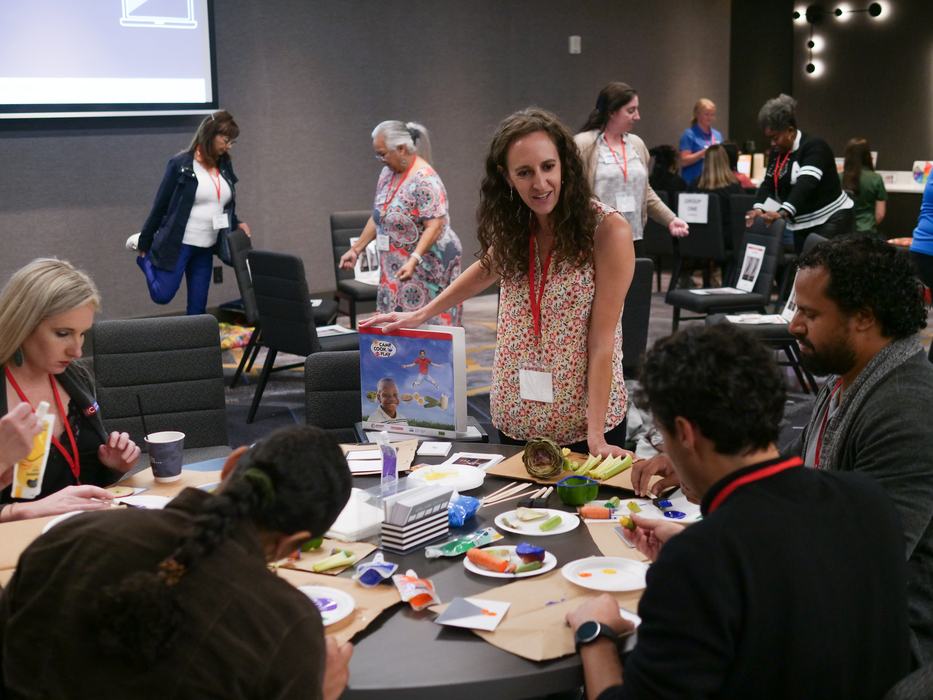 Jackie teaching educators to use a curriculum activity 