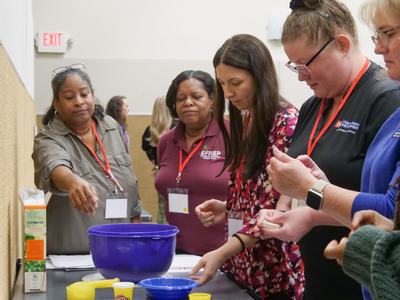 EFNEP staff measuring items for a food recall training