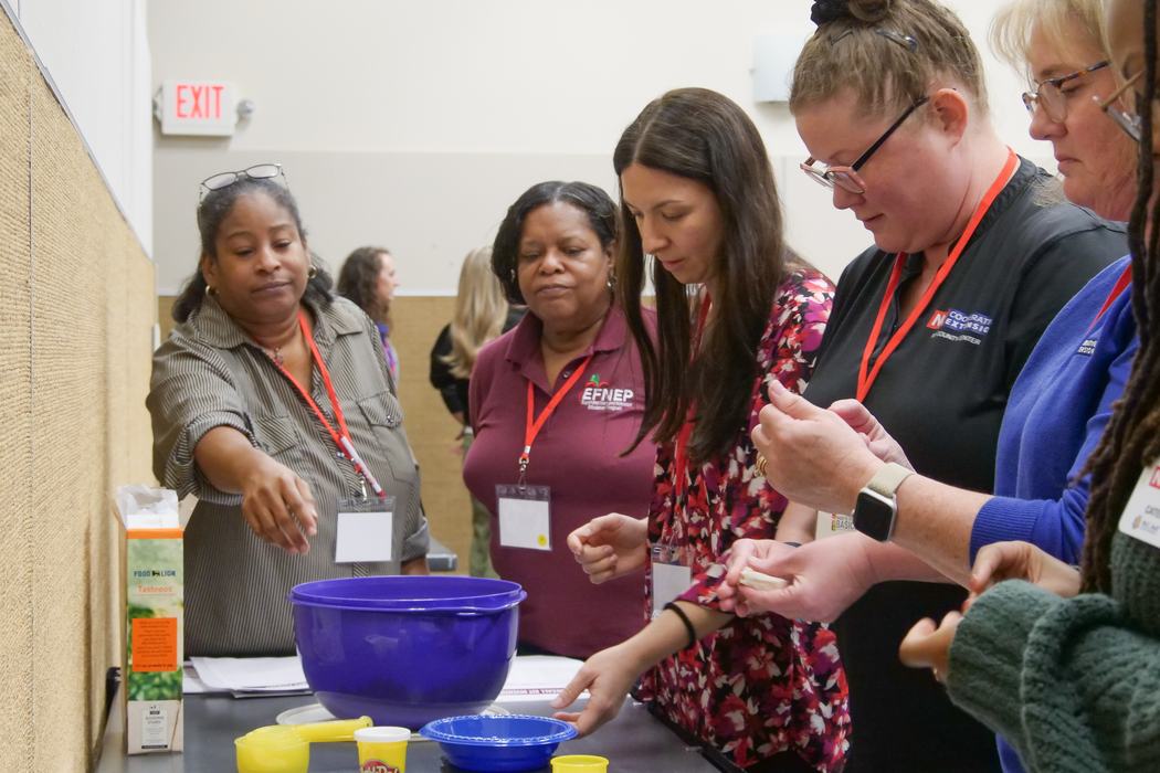EFNEP staff measuring items for a food recall training