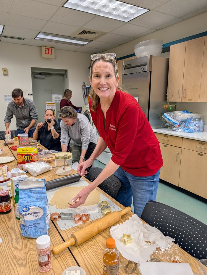A woman makes food in a local kitchen.