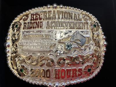 Ornate engraved belt buckle reading "Reserve Champion" and "2000 ROPERS"