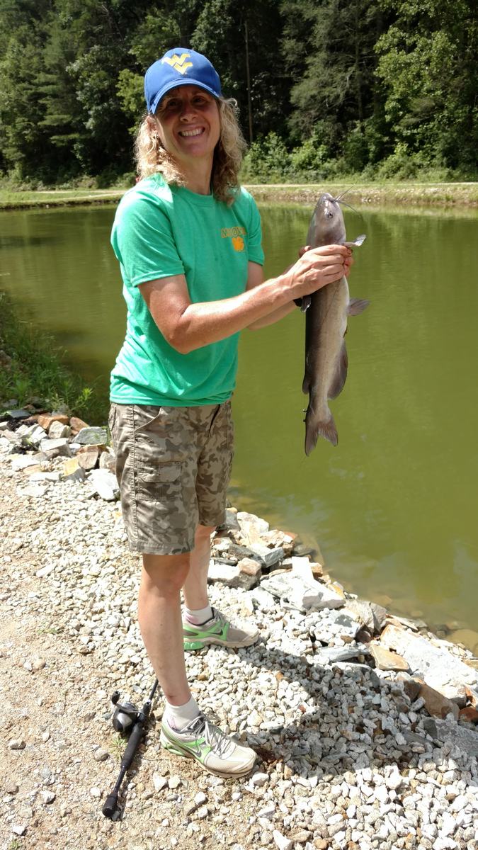 Molly holding a catfish