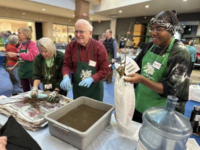 Volunteers handing out trees during 2025 TreeFest