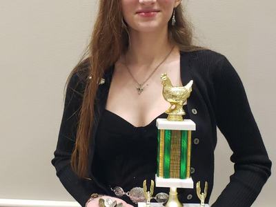 4-Her Lexi Gilkey and her various awards at the National 4-H Poultry Judging Contest