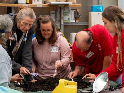 Participants in the Therapeutic Horticulture_s Open Community Social Group learn about Vermicomposting while getting hands-on experiences