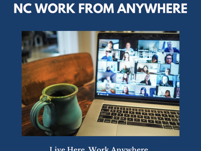 An image of a coffee cup on a desk next to a laptop computer. The screen on the laptop shows a virtual meeting in progress. Text headline is 'NC WORK FROM ANYWHERE Live Here. WorkAnywhere."