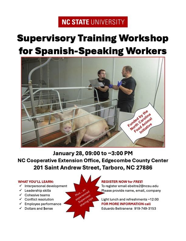 NC State University: Supervisory Training Workshop for Spanish-Speaking Workers; two men with a pig