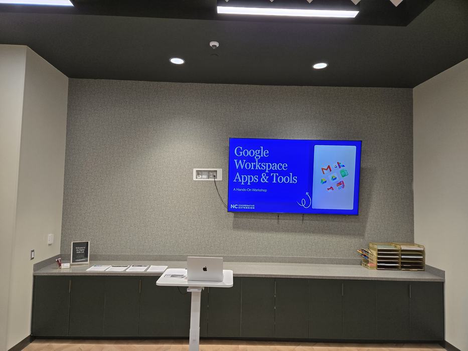 A vestibule with signage for a Google Workspace workshop.