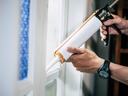 Caulking interior window.