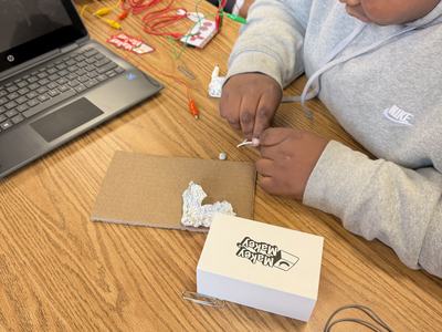 Youth testing household materials