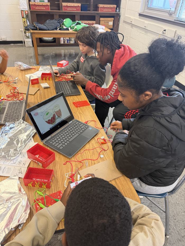 Youth using tested materials to play  musical instruments 