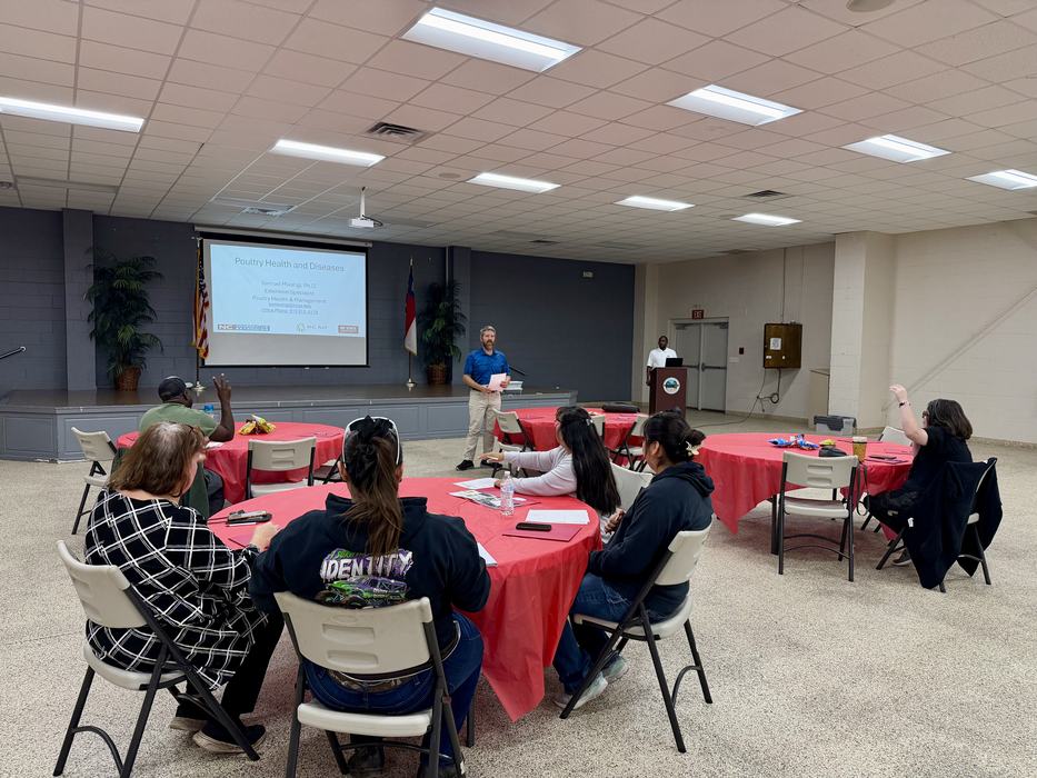 People learn from a speaker discussing poultry.