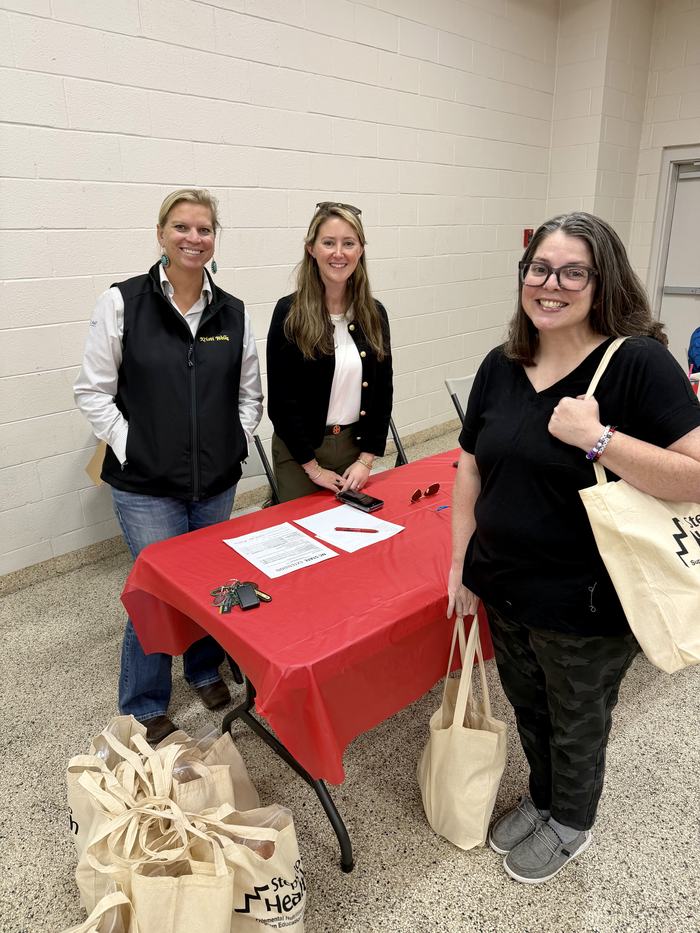 Jones Staff at a table for Steps to Health.