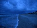 Storm clouds roll across Ocean Isle at dawn.