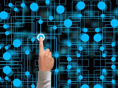 A human finger selects one node in the complex web of a neural network. Image by Gerd Altman from Pixabay.
