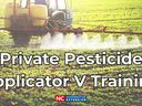 Tractor spraying a field