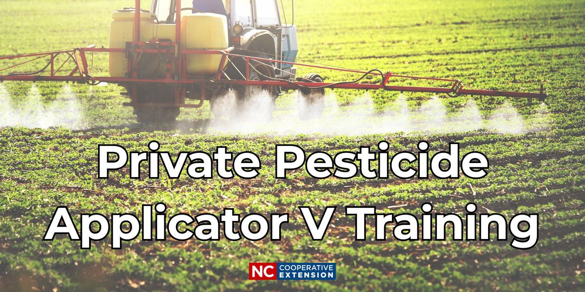 Tractor spraying a field