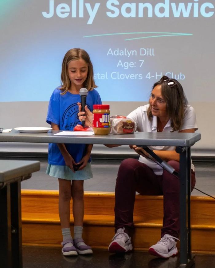 4-H youth, Adalyn Dill, participates in County Activity Day, learning public speaking skills. Photo courtesy of N.C. Cooperative Extension