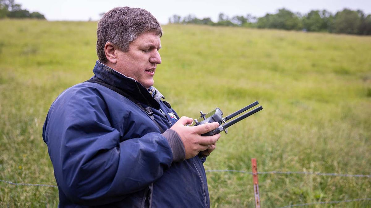 Yancey County Extension director David Davis with a controller for an agricultural drone