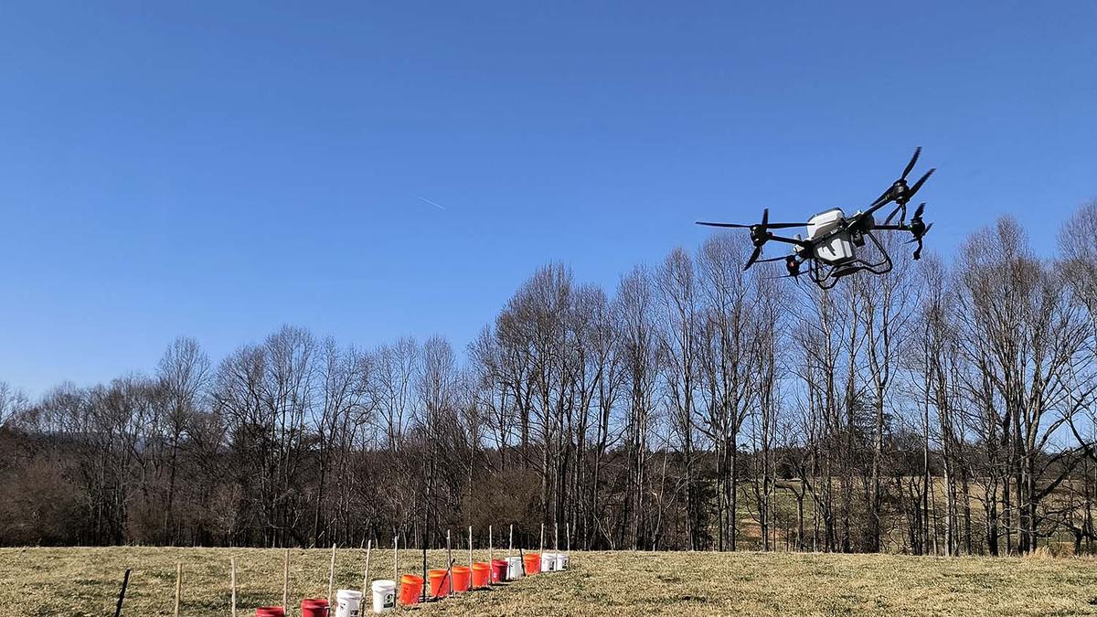 An agricultural drone flying over a field.