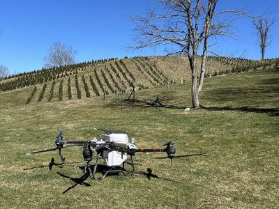 A drone performs a calibration on clover seed. The calibration lets the drone know how much seed is being dispensed as the gate transitions from fully closed to fully open.
