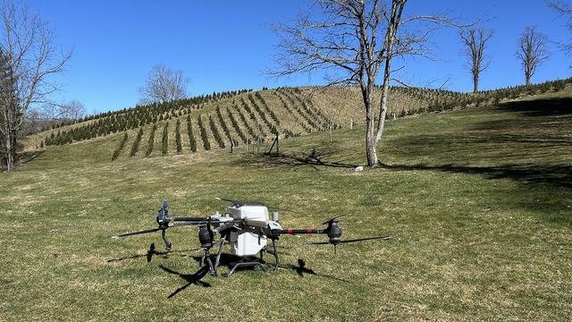 A drone performs a calibration on clover seed. The calibration lets the drone know how much seed is being dispensed as the gate transitions from fully closed to fully open.