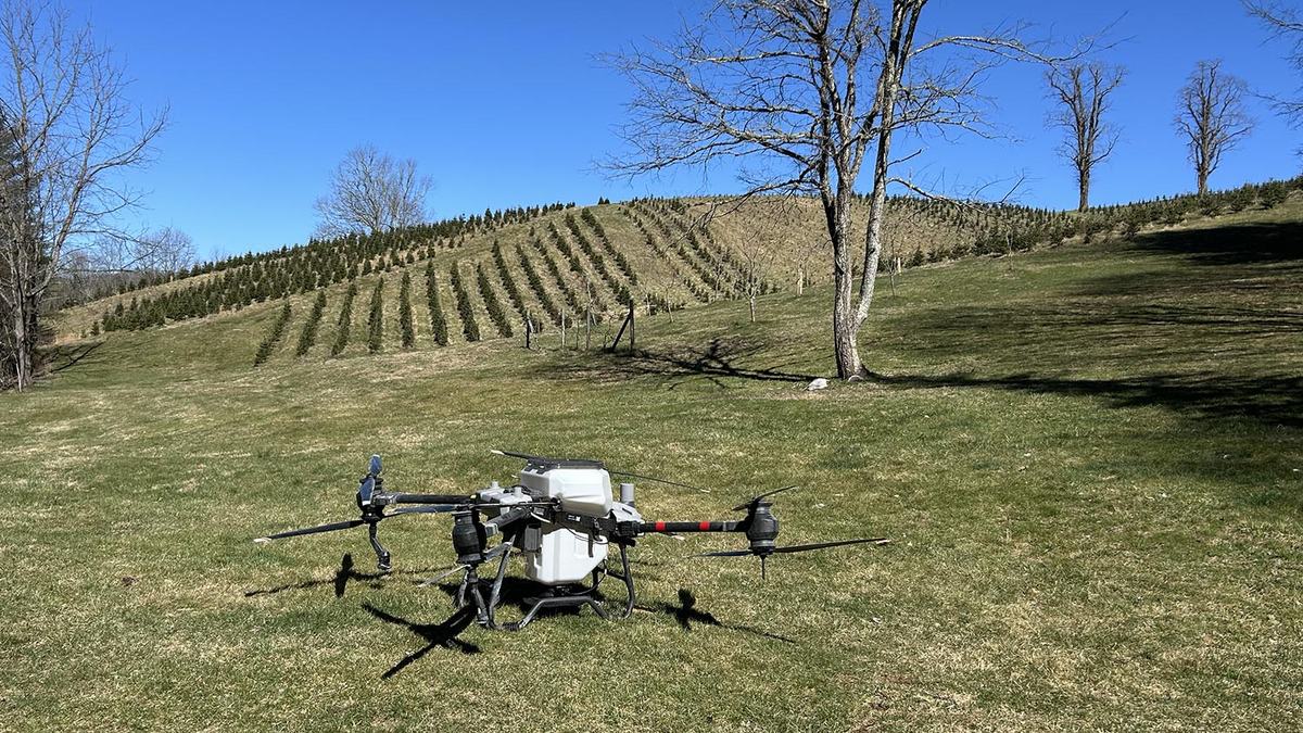 An agricultural drone parked in a field