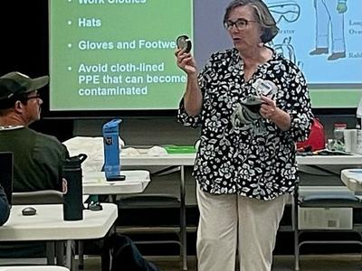 Woman teaching pesticide safety